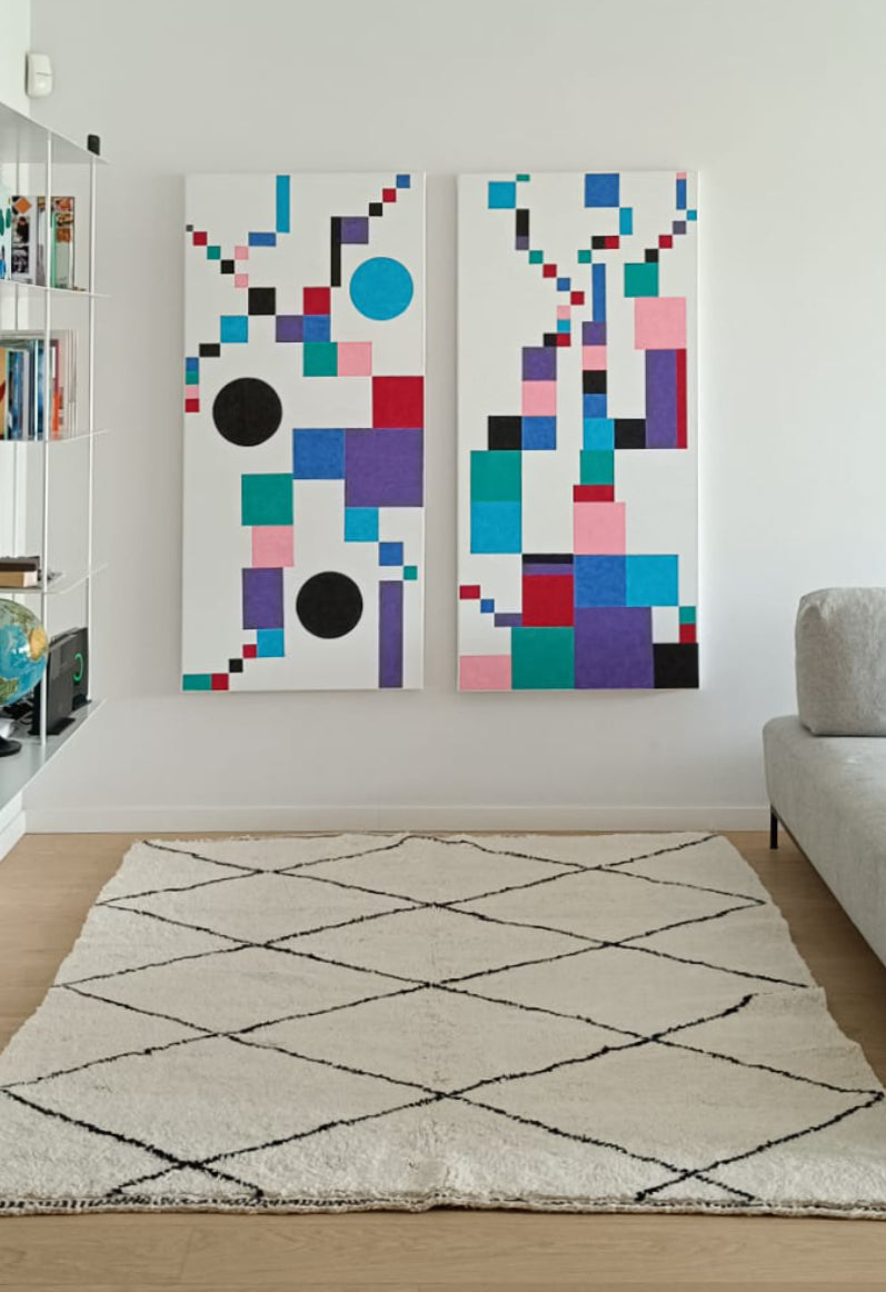 Authentic Moroccan Beni Ourain rug with diamond pattern in a modern living room, complemented by colorful geometric artwork and minimalist decor.