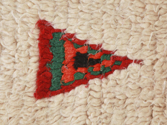 vintage rug detail whiet background triangle red gree oraneg black