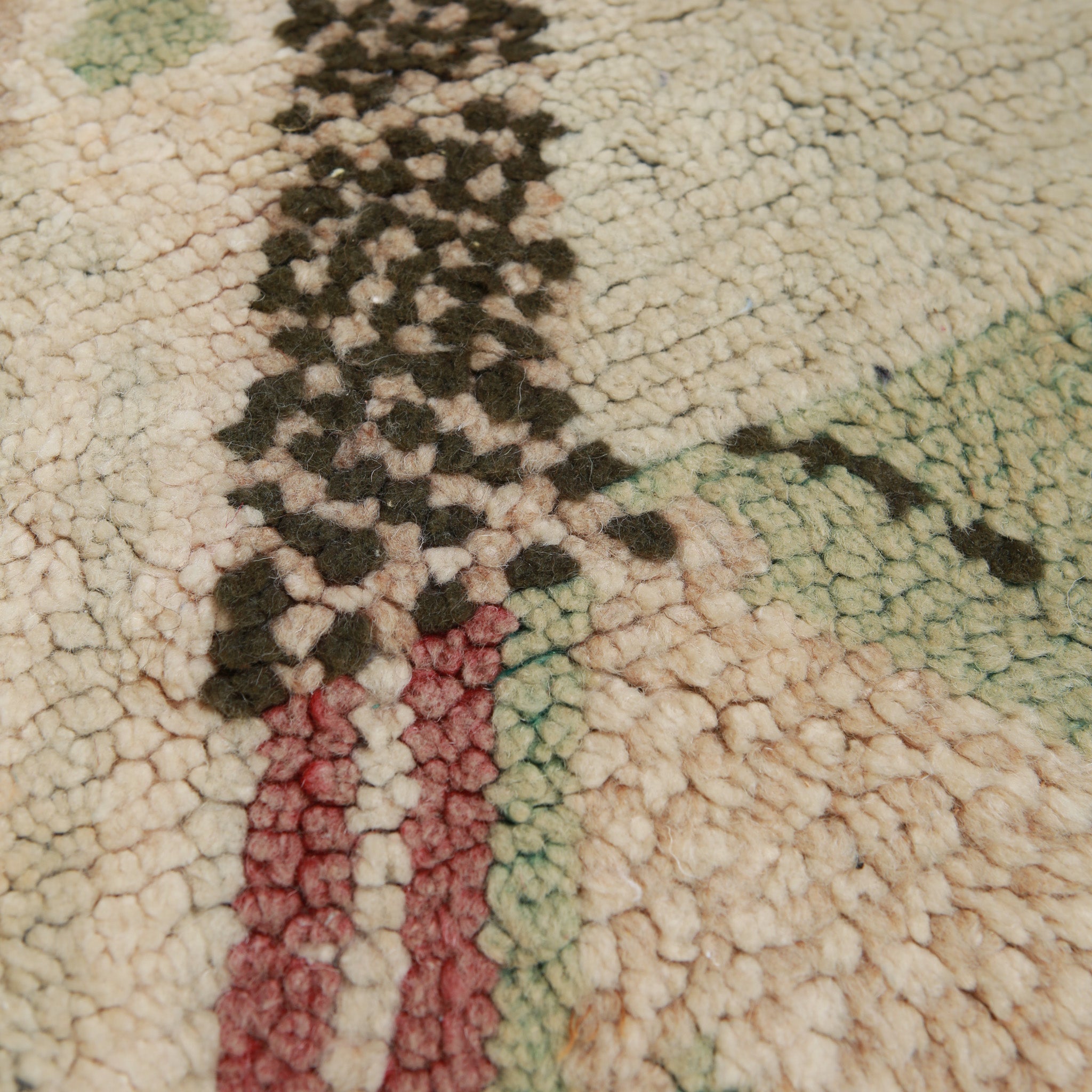 Close-up of vintage Beni Mrirt rug texture showing dense wool knots and geometric pattern in natural colors