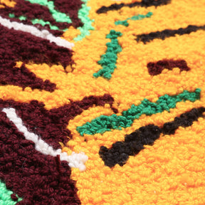 dettaglio del tessuto di un tappeto zyndekh con tessuto giallo marrone nero verde e bianco